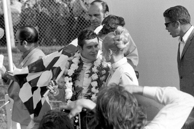 Jacky Ickx celebrates on the podium afterw inning the 1970 Canadian Grand Prix