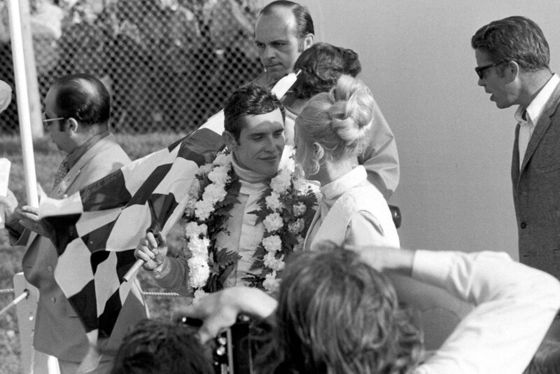 Jacky Ickx celebrates on the podium afterw inning the 1970 Canadian Grand Prix