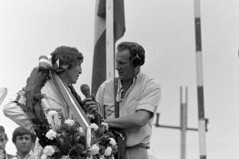 Lotus' Jochen Rindt is interviewed on the podium after winning the 1970 Dutch Grand Prix.