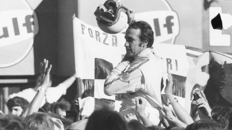 Swiss racing driver Clay Regazzoni is grabbed by members of the crowd after winning the Italian Grad Prix at Monza, September 8th 1970. (Photo by Keystone/Hulton Archive/Getty Images)