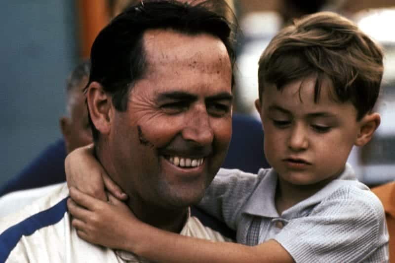 Jack Brabham holds one of his children after winning the 1970 South African Grand Prix