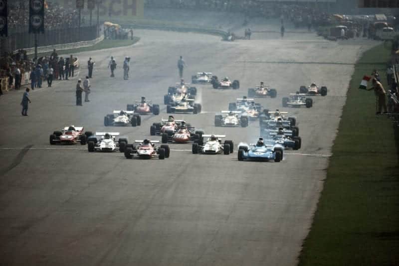 Cars pull away as the 1971 Italian Grand Prix starts.