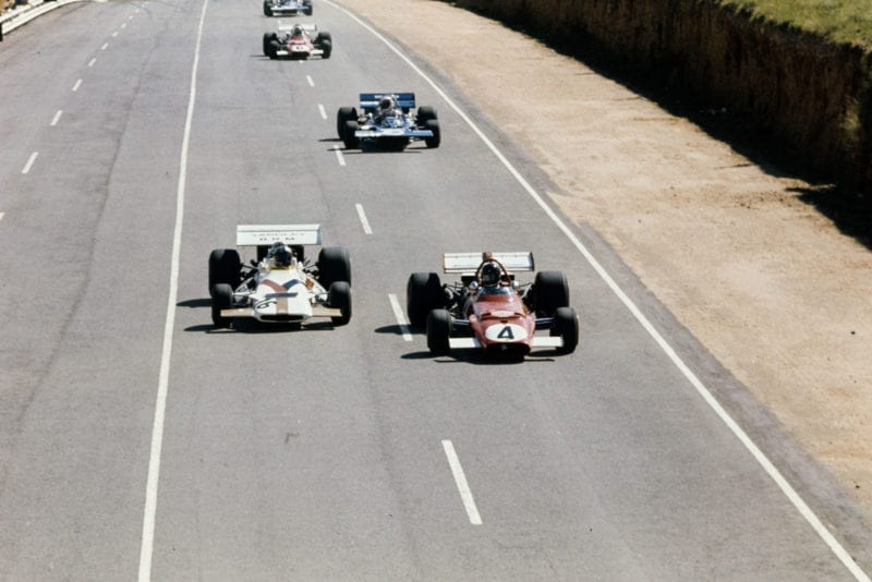 BRM's Pedro Rodriguez, left, and Ferrari's Jacky Ickx do battle on the main straight at the 1971 South Africa Grand Prix.