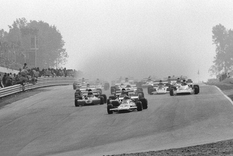 The 1971 United States Grand Prix gets underway in wet conditions.
