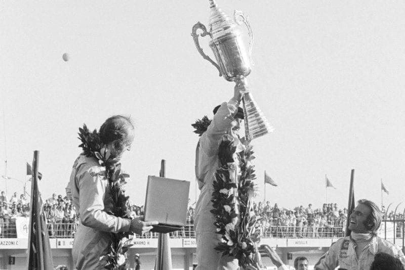 Tyrrell's Jackie Stewart celebrates winning the 1972 Argentine Grand Prix.