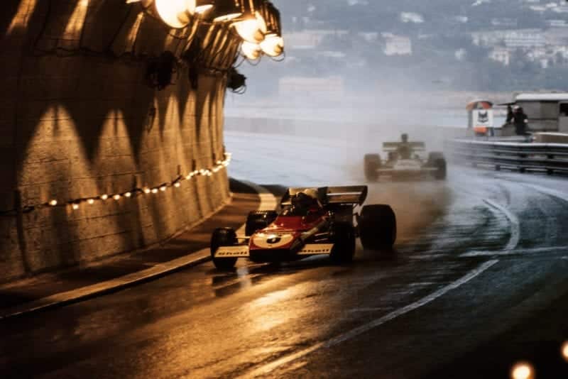 Ferrari's Jacky Ickx blasts through the tunnel in wet conditions at the 1972 Monaco Grand Prix.