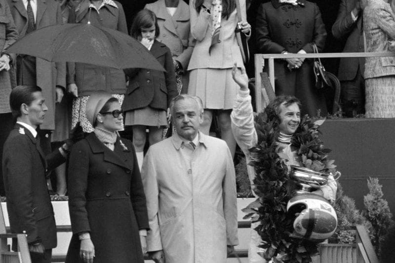 Jean-Pierre Beltoise celebrates his victory on the podium at the 1972 Monaco Grand Prix.