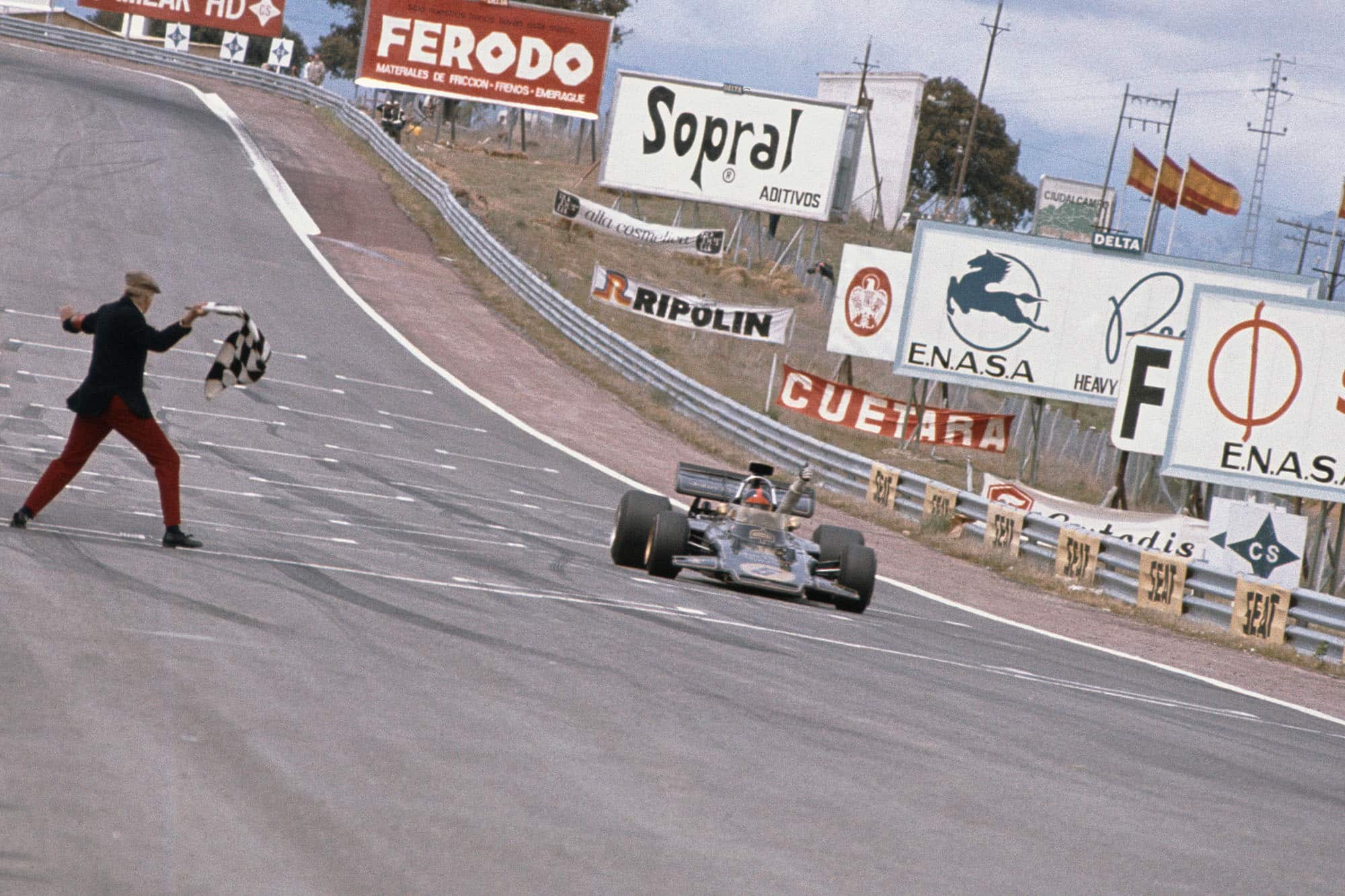 Emerson Fittipaldi takes the chequered flag to win the 1972 Spanish Grand Prix