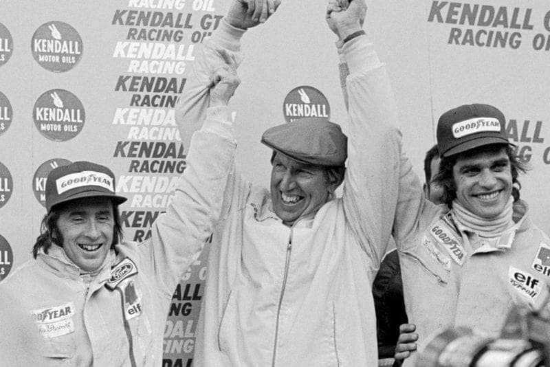 Jackie Stewart (left), Ken Tyrrell (centre) and Francois Cevert (right) celebrate their victory at the 1972 United States Grand Prix, Watkins Glen.