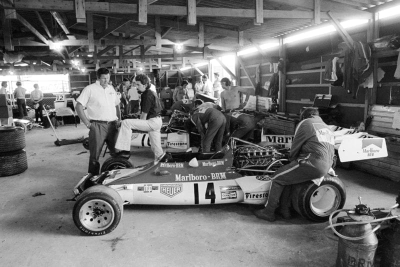 Communal indoor working facilities for the teams. BRM team Manager Tim Parnell(GBR) talks to new BRM designer Mike Pilbeam(GBR), right Argentine GP, Buenos Aires, 28 January 1973