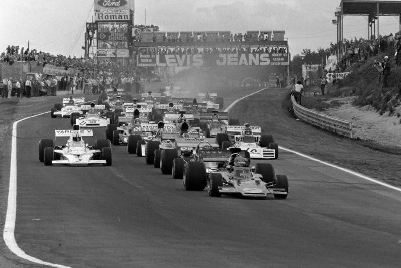 Ronnie Peterson leads the field into the first corner at the 1973 Belgian Grand Prix