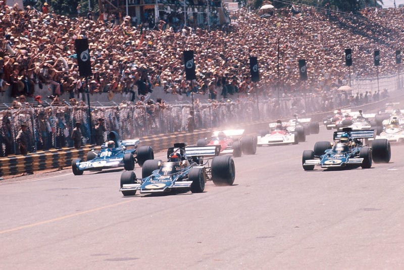 Emerson Fittipaldi (Lotus) takes the lead at the start of the 1973 Brazilian Grand Prix, Interlagos.