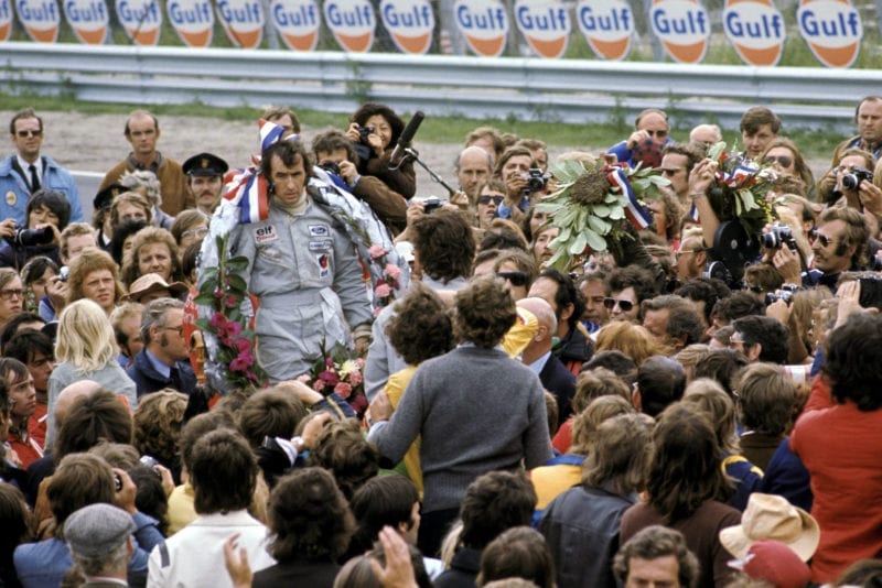 Jack Stewart stands on the podium after winning the 1973 Dutch Grand Prix, Zandvoort.