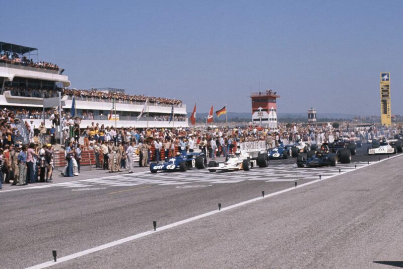 The 1973 French Grand Prix begins as the cars line up on the grid.