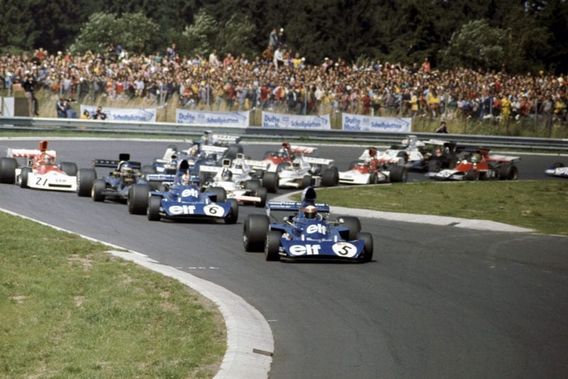 Jackie Stewart (Tyrrell) leads the field out of the first corner of the 1973 german Grand Prix, Nurburgring.