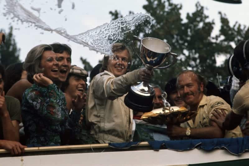 Ronnie Peterson celebrates on the podium after winning the 1973 Italian Grand Prix, Peterson.