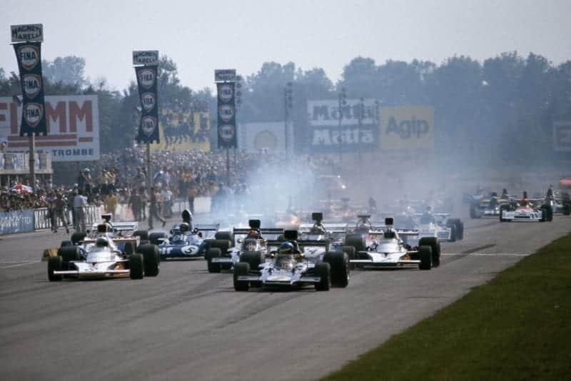 Cars smoke their tyres as the 1973 Italian grand Prix gets underway.