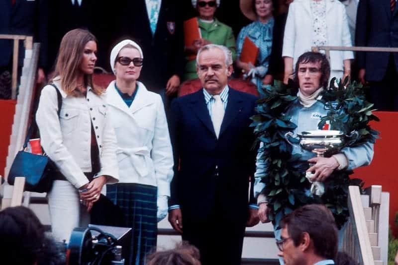Jackie Stewart stands on the podium after winning the 1973 Monaco Grand Prix.