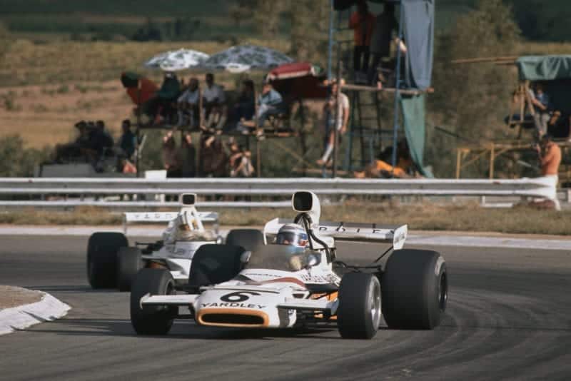 Peter Revson leads Denny Hulme at the 1973 South African GRand Prix, Kyalami.