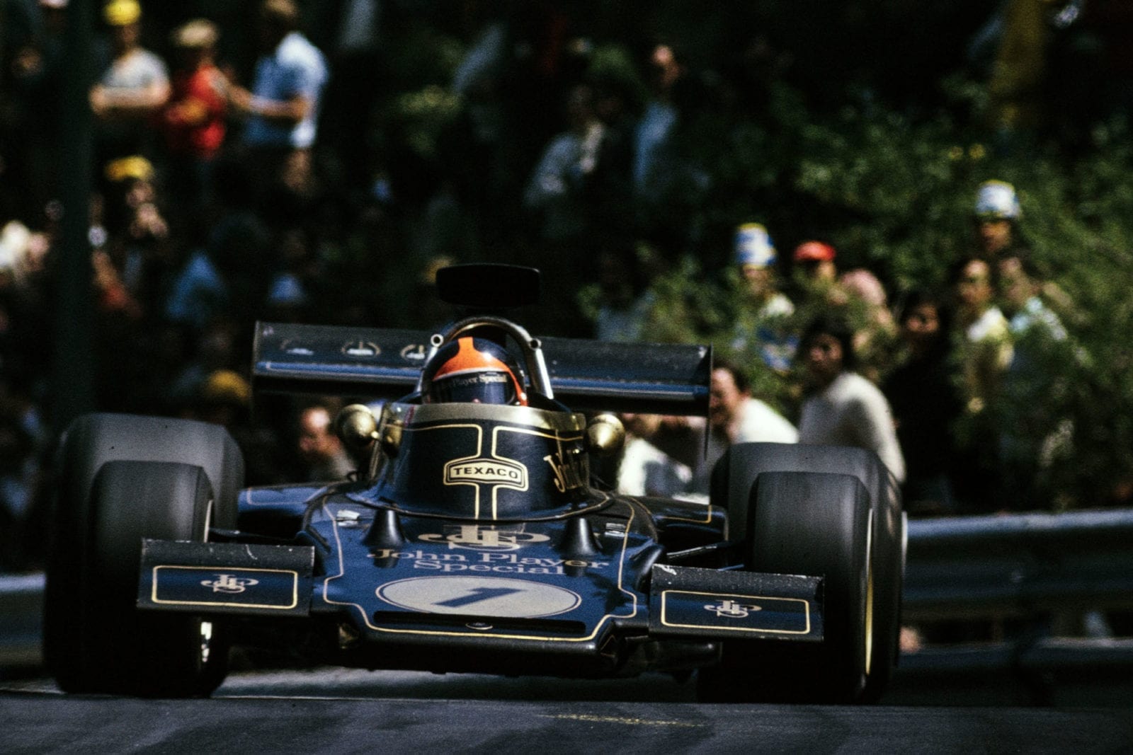 Emmerson Fittipaldi pushing in his Lotus at the 1973 Spanish Grand Prix.