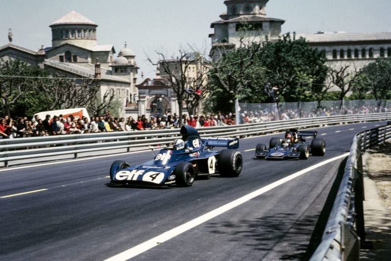 Emerson Fittipaldi chases Stewart at the 1973 Spanish Grand Prix, Montjuïch Park.