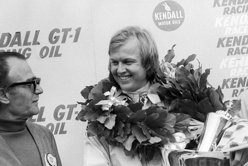 Ronnie Peterson (Lotus) smiles on the podium at the 1973 United States Grand Prix, Watkins Glen.