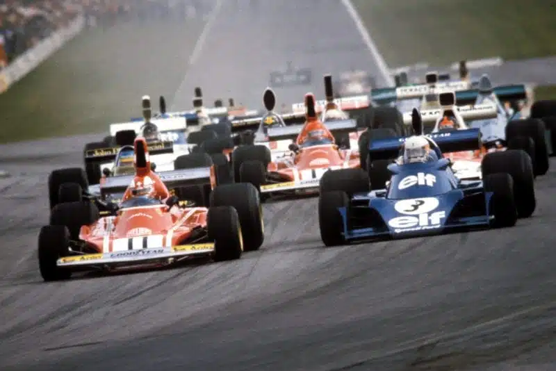 Clay Regazzoni (Ferrari) leads into the first corner of the 1974 Belgian Grand Prix, Zolder.