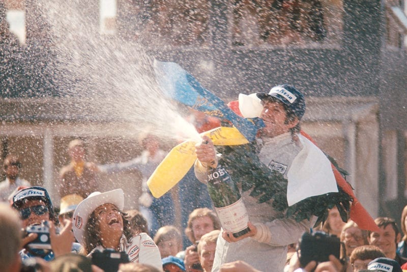 Jody Scheckter sprays the champagne after winning the 1974 Swedish Grand Prix.