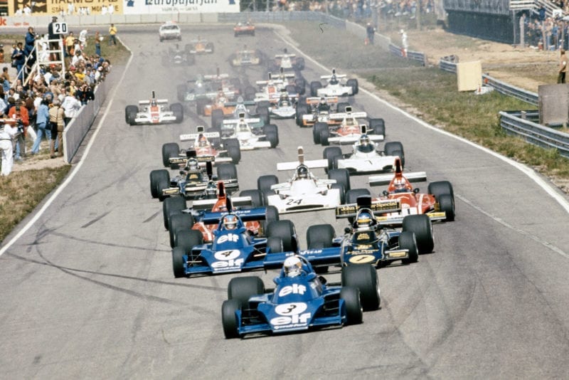Jody Scheckter (Tyrrell) leads into the first corner of the Spanish Grand Prix.