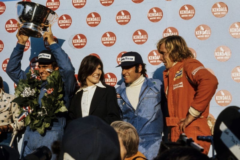 Carlos Reutemann (Brabham) celebrates on the podium.