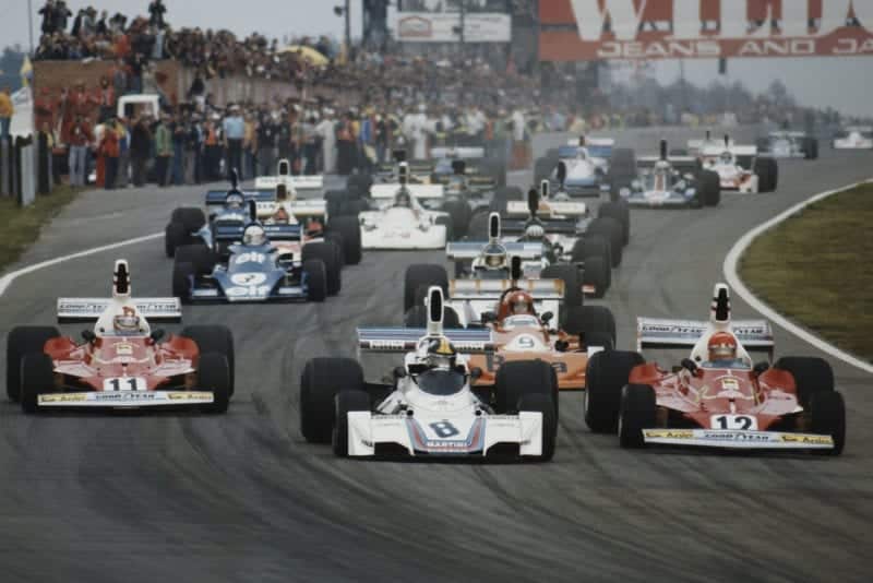 The field crowds into Turn One at the start of the 1975 Belgian Grand Prix, Zolder.