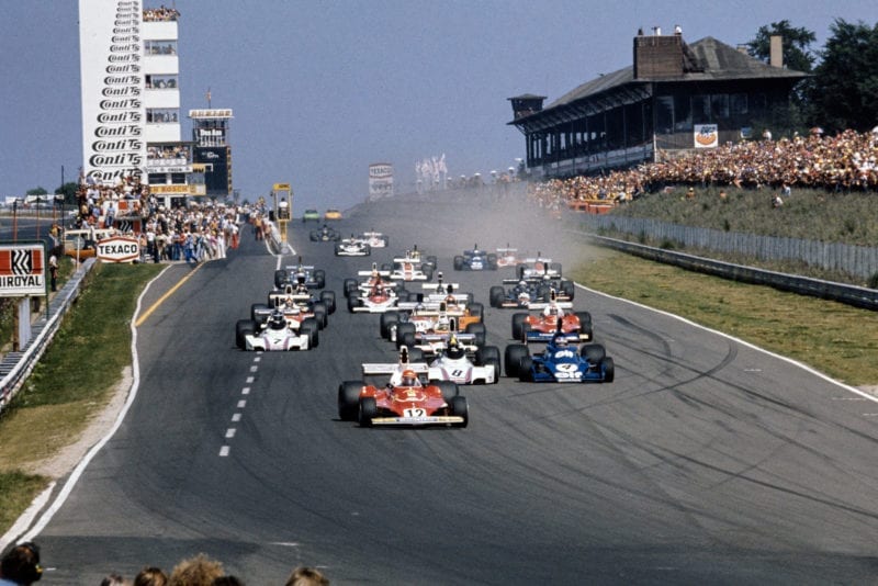 Niki Lauda leads the field into the first corner at the 1975 German Grand Prix, Nurburgring.