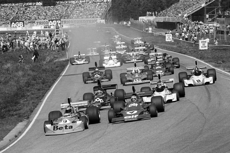 Vittorio Brambilla leads into the first corner of the 1975 Swedish Grand Prix, Anderstorp.
