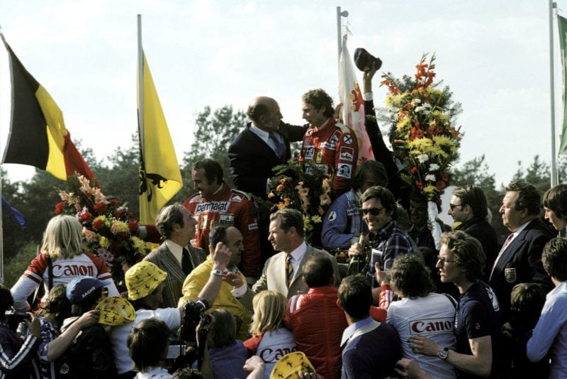 Niki Lauda celebrate son the podium after winning the 1976 Belgian Grand Prix.