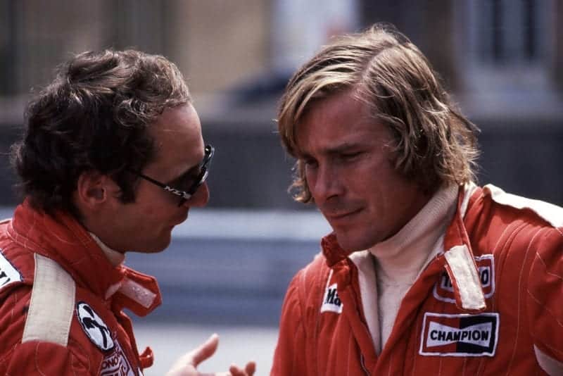 Niki Lauda (Ferrari) talks to James Hunt (McLaren) at the 1976 Monaco Grand Prix.