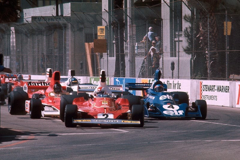 The cars squeeze into Turn 1 at the start of the 1976 United States Grand Prix, Long Beach.