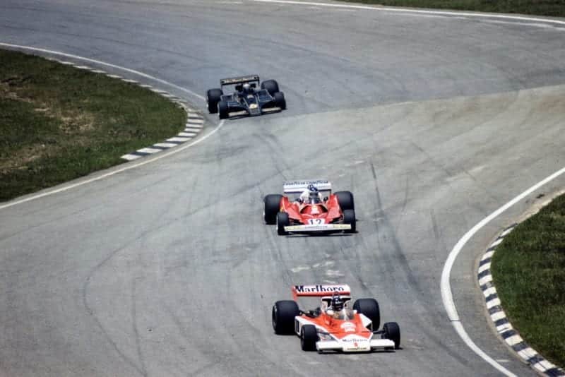 James Hunt (McLaren) leads Carlos Reutemann (Ferrari) and Mario Andretti (Lotus), 1977 Brazilian Grand Prix, Interlagos.