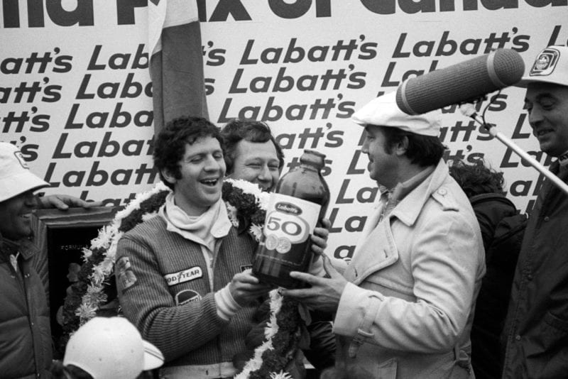 Jody Scheckter (Wolf) is overjoyed with his win at the 1977 Canadian Grand Prix, Mosport Park.