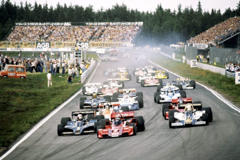 John Watson (Brabham) leads as the cars head for the first corner at the 1977 Swedish Grand Prix, Anderstorp.