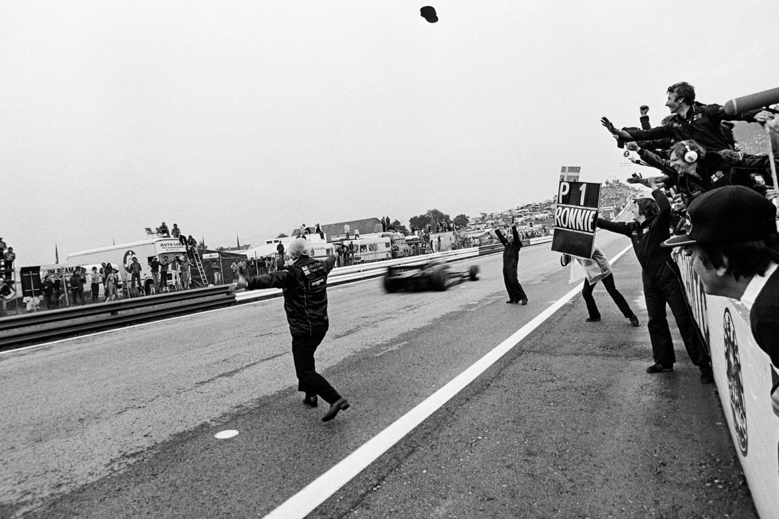 ROnnie Peterson (Lotus) passes the finish line to win the 1978 Austrian Grand Prix.