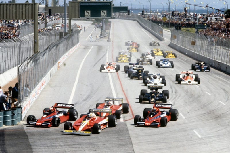 The field squeezes into Turn One at the 1978 United States Grand Prix West, Long Beach.