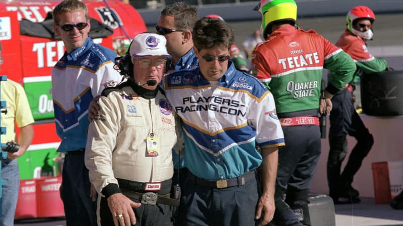 3-Greg-Moore-IndyCar-driver's-crew-members-console-one-another-after-his-fatal-crash