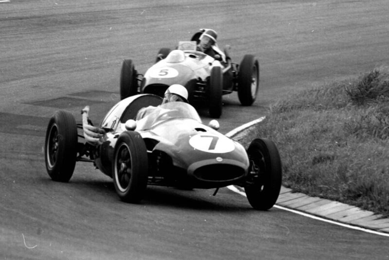 Roy Salvadori driving a Cooper T45 Climax ahead of Mike Hawthorn in a Ferrari Dino 246