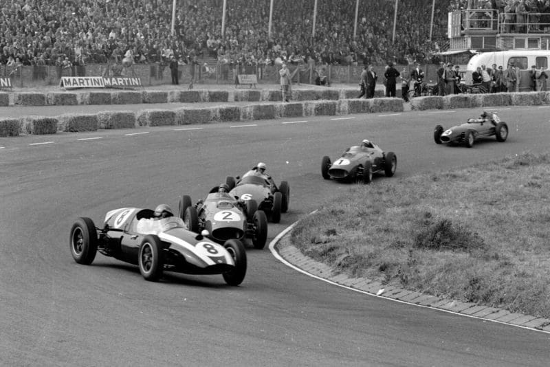 Jack Brabham driving a Cooper T51-Climax leads Tony Brooks' Ferrari Dino 246 and Harry Schell's BRM P25.
