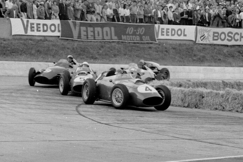 Stirling Moss leads Maurice Trintignant both in Cooper T51 Climaxs and Carroll Shelby in an Aston Martin DBR4/250 into the hairpin.