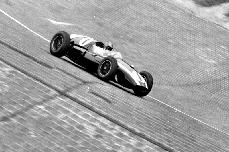 Jack Brabham pushes his Cooper T51 Climax) around the banked North Turn.