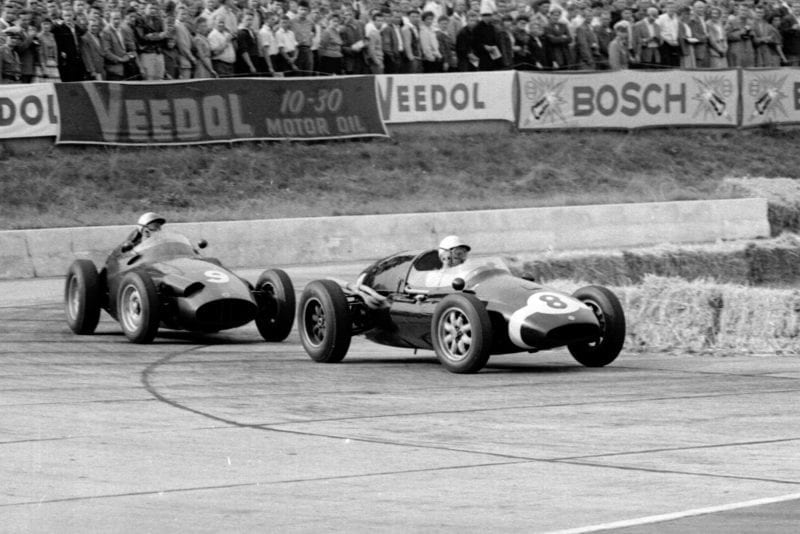 Maurice Trintignant in a Cooper T51 Climax lleads Jo Bonnier in a BRM P25 through the Hairpin.