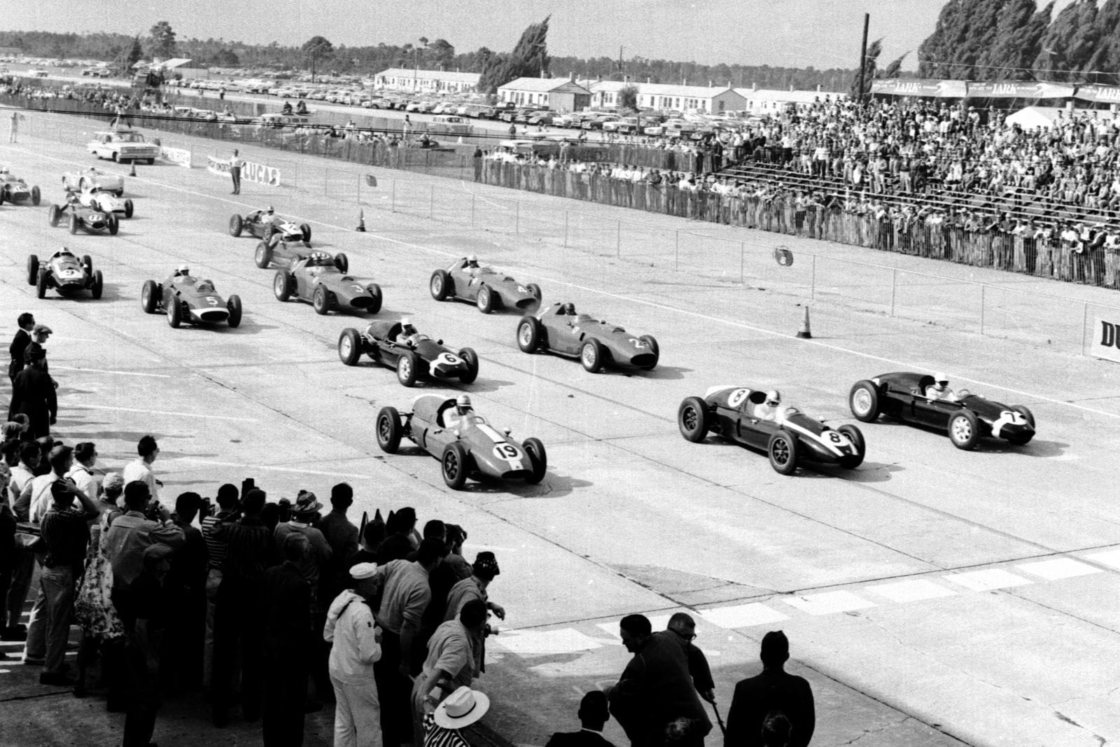 Stirling Moss, Jack Brabham and Harry Schell lead at the start of the race.
