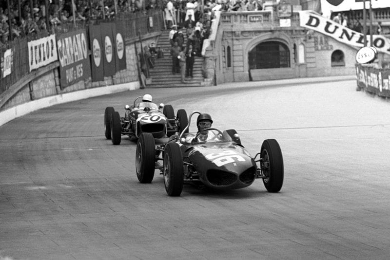 Second place finisher Richie Ginther holds off eventual winner Stirling Moss.