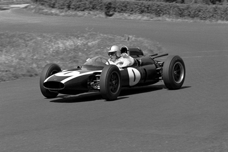 Jack Brabham in the Cooper T58, which spun out on the first lap when his throttle jammed.